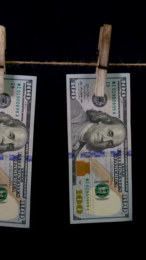 Dollars dry on a clothespin rope Stock Footage 318364296