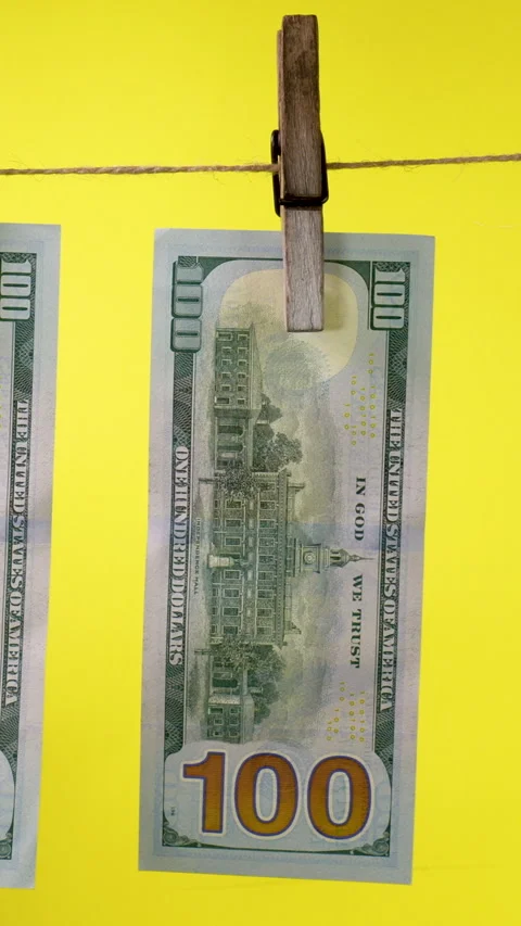 Dollars dry on a clothespin rope Stock Footage 325768262