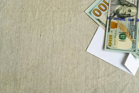 Dollars in an envelope on the table. Template for design, space to insert text Stock Photos