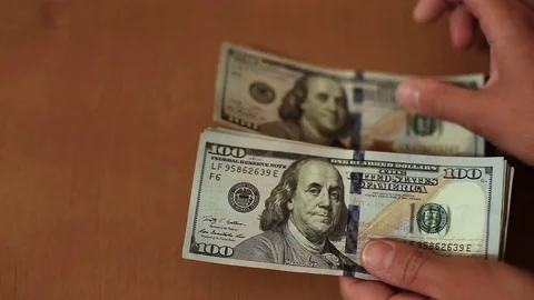 Dollars in female hands Stock Footage 83665647
