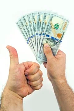 Dollars in hand Stock Photos
