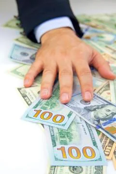 Dollars in hand Stock Photos
