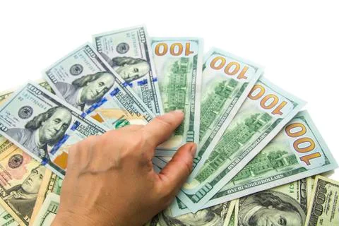 Dollars in hand Stock Photos