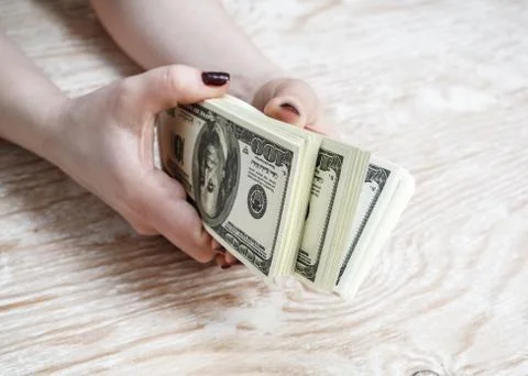 Dollars in hands Stock Photos
