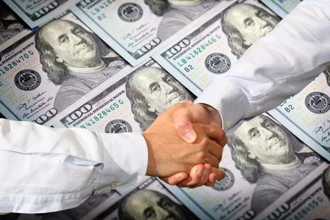 Dollars handshake Stock Photos
