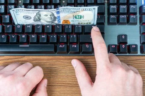 Dollars on the keyboard Stock Photos