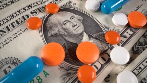 Dollars with pills on the table Video stock 121643897