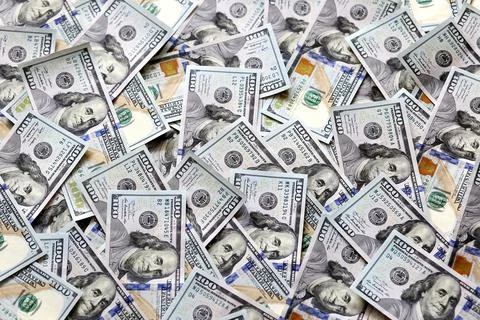 Dollars scattered across the table Stock Photos