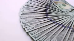 One Hundred And Fifty Dollar Bills Spread Out In A Fan Stock Photo