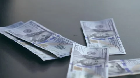 Dollars on the table Video stock 284444068