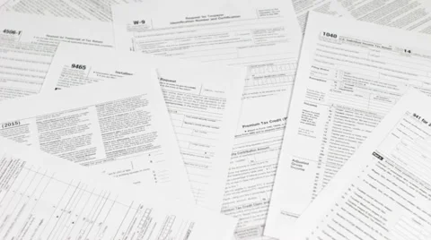 Dollars Thrown on Tax Forms Stock Footage 61020778