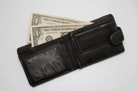Dollars in wallet on white background Stock Photos