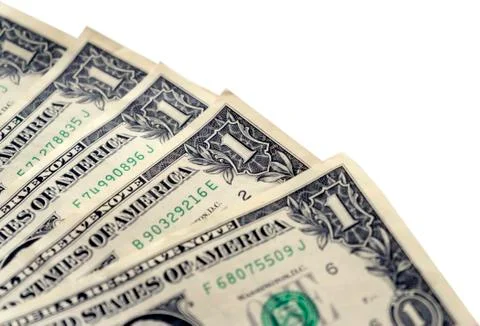Dollars on a white background, closeup. Stock Photos