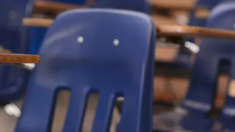 DOLLY ACROSS CLASSROOM OF EMPTY SCHOOL DESKS - 4k Stock Footage 159673364