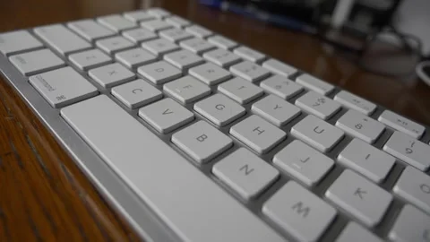 A dolly across a computer keyboard Stock Footage 295453938