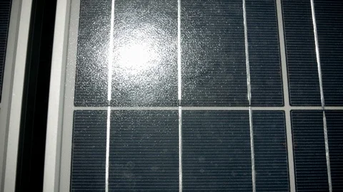 Dolly across solar panel with sun reflection Stock Footage 125795690
