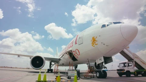 Dolly around airplane running engine close Stock Footage 118962687