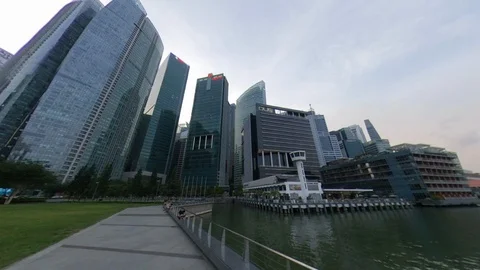 Dolly backwards look up buildings NTUC Marina Bay Singapore Stock Footage 119746444