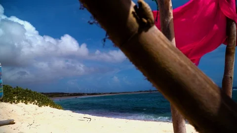 Dolly beach flag slow motion windmills in the  background Stock-Footage 95235112