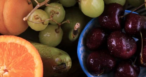 Dolly bird eye close up view of an assortment of fresh, healthy, organic fruits Stock Footage 71850159