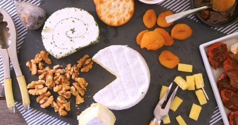 Dolly bird eye view of an assortment of French and British cheese Stock Footage 72173115