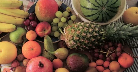 Dolly bird eye view of an assortment of fresh, healthy, organic fruits Stock Footage 72378634