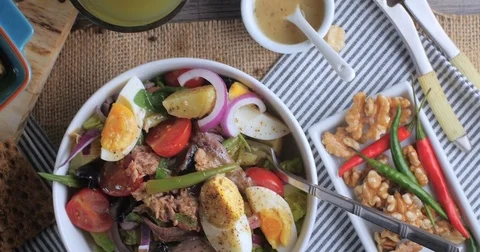 Dolly bird eye view of a fresh, healthy, organic nicoise salad Stock Footage 72175519