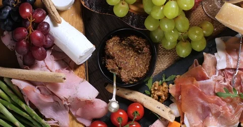 Dolly bird eye view of a platter of cured meat (charcuterie) 動画素材 72177666