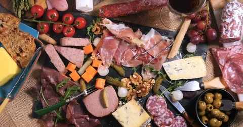 Dolly bird eye view of a platter of cured meat (charcuterie) 動画素材 72380231