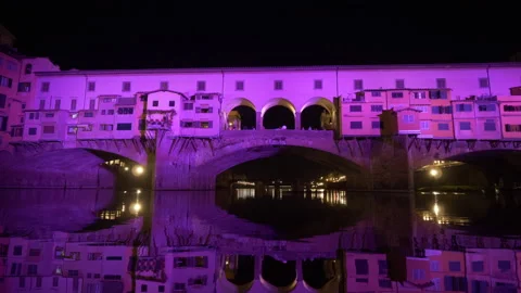 Dolly Bridge Ponte Vecchio in river Arno pink light during night, 4K Stock-Footage 134613953