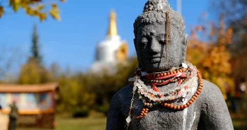 Dolly camera move along the statue of Buddha . Slowly sliding, close-up shot. Stock Footage 124231069