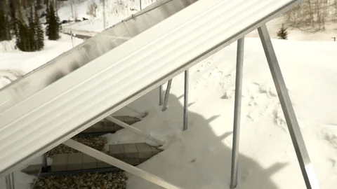 Dolly camera move on solar panels mounted on roof in the mountains of Utah. Stock Footage 99471450