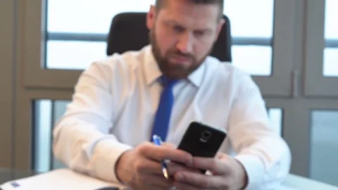 Dolly close up on businessman's hands coping data from smartphone to calendar Stock Footage