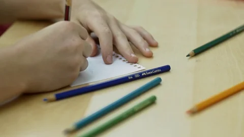 Dolly close up of hands drawing Stock Footage 78753695