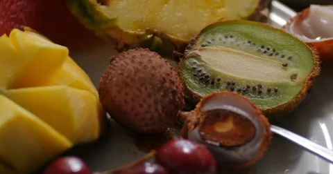 Dolly close up panning view of an assortment of fresh, healthy, organic fruits Stock Footage 72177055