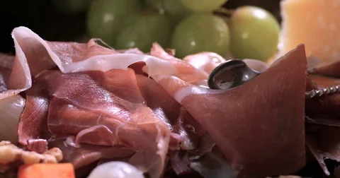 Dolly close up panning view of a platter of cured meat (charcuterie) Stock Footage 72177212