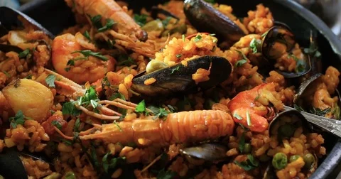 Dolly close up panning view of a Spanish seafood paella 動画素材 74067482