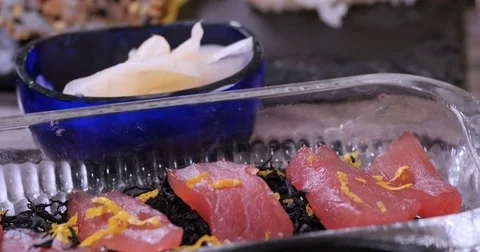 Dolly close up push in view of an assortment of Japanese food Stock Footage 74069562