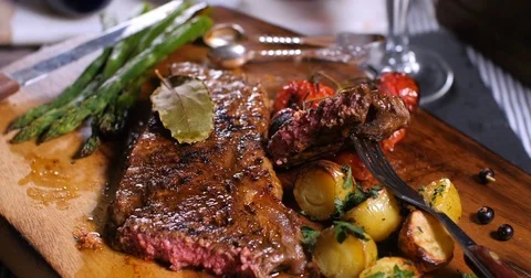 Dolly close up push in view of a delicious sirloin steak Stock Footage 74067700