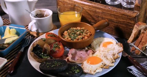 Dolly close up push in view of a full cooked English breakfast Stock Footage 72950267