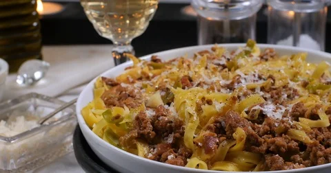 Dolly close up view of delicious steamy fettuccine in bolognese sauce Stock Footage 75275619