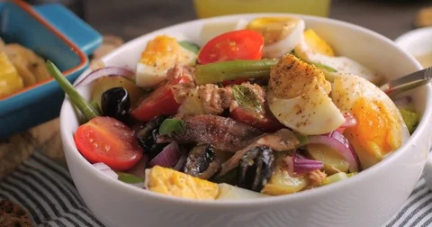 Dolly close up view of a fresh, healthy, organic nicoise salad Stock Footage 71847647