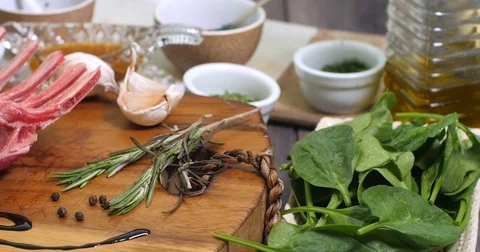 Dolly close up view of ingredients for minted rack of lamb Stock Footage 74068116