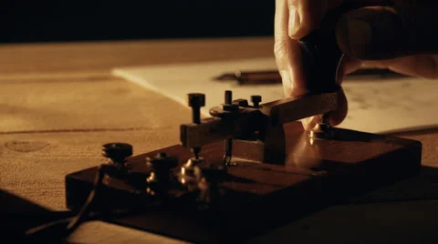 Dolly closeup of a telegrapher using a morse code key 4k 스톡 동영상 66740134