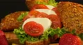 dolly from defocus spelt chia bun with tomato mozzarella 4k or 4k+ Resolution