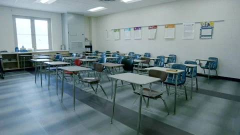 Dolly to empty chairs in school classroom. Stock Footage 281858940
