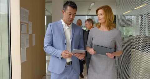 Dolly Executives Heading For Meeting Stock Footage 97136226