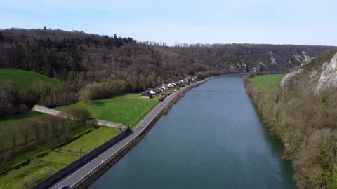 Dolly In: Fly over river Meuse (Belgium) Stock Footage 202208909