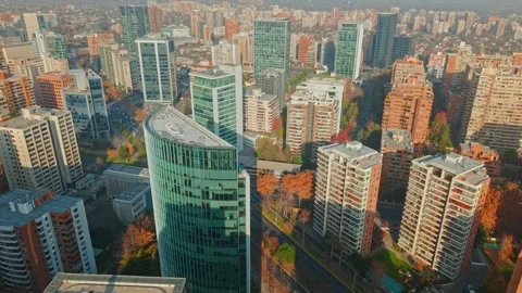 Dolly in flyover of modern office and residential buildings on a sunny day in Stockbeeldmateriaal 340322635