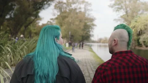 Dolly forward shot of a couple of plus size people walking at park Stock-Footage 139354196